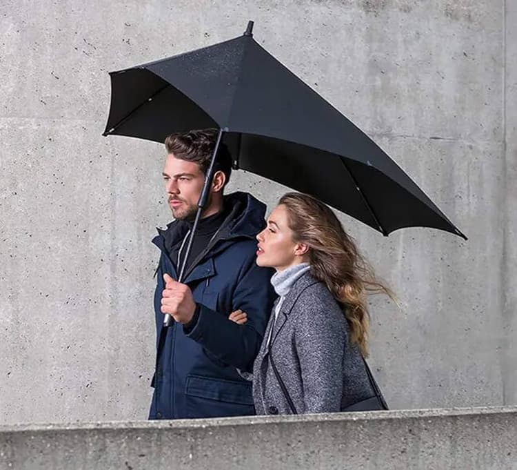 2 people under a stormproof umbrella